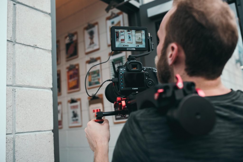 A Man With A Camera And Stabilizer