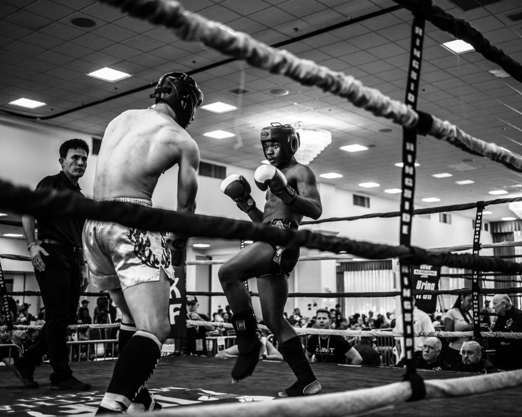 A Photo Of Two Men Engaging In Muay Thai