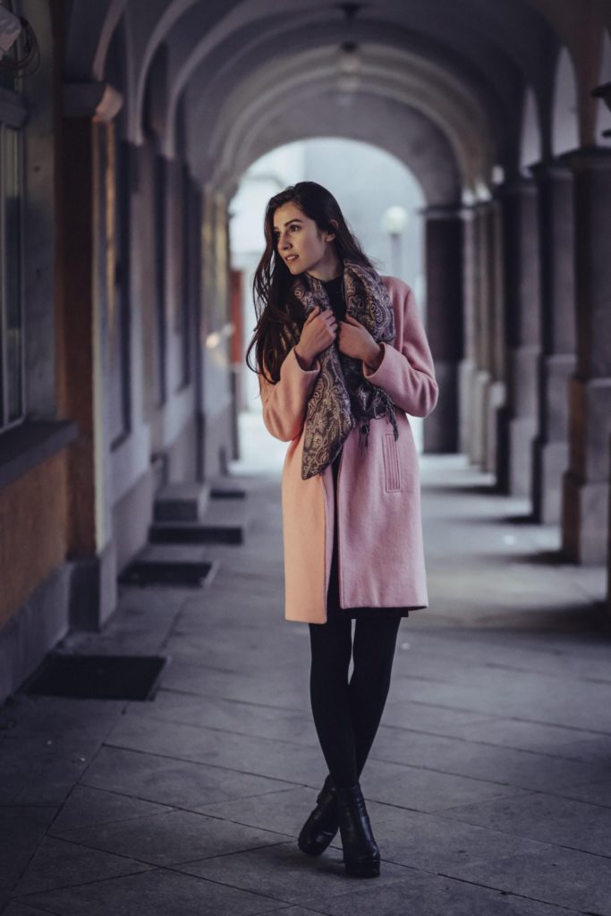 Brunette Woman Wearing Scarf And Pink Jacket